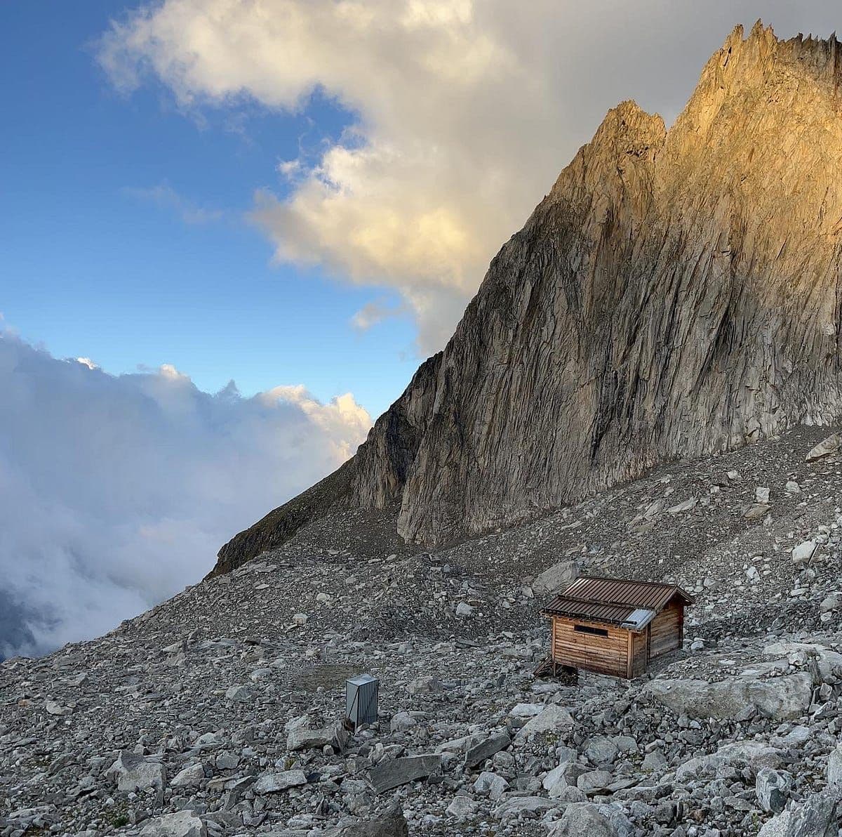 Some chains on the way up, Curios sheep and Fusshornbiwak sitting above the clouds.
