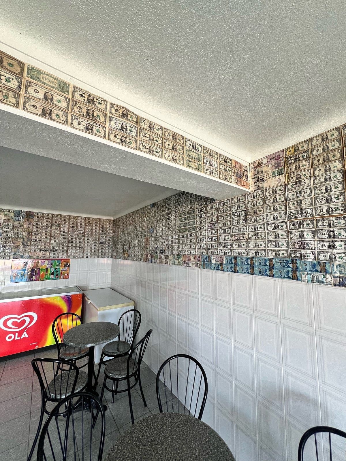 The wall tells a story of who has pass through this small remote cafe